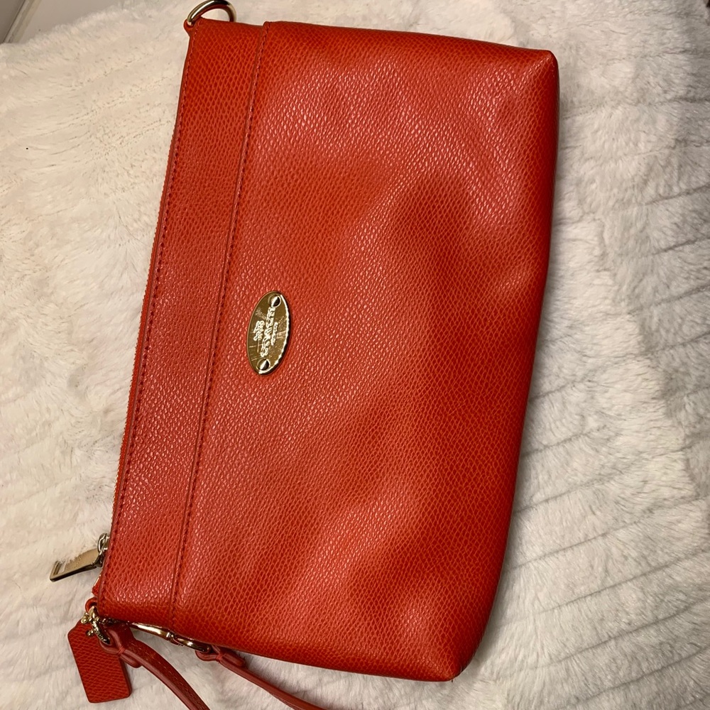 Coach clutch in red/orange color